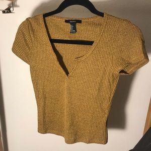 mustard yellow cropped shirt